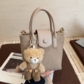 Mini khaki frosted bucket bag with a cute brown teddy bear plush charm and top handle - With Charm / Beige Grey