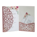 Detail of rose gold glitter laser cut wedding invitation with intricate floral vine pattern - Glitter Pink