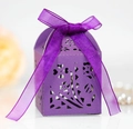 Macro shot of laser-cut floral candy box in purple cardstock with elegant ribbon bow - Dark Purple