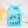 Detail of light blue laser-cut gift box with bell pattern and blue ribbon bow - Tiffany Blue