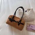 Flat lay of brown suede shoulder bag with black handles on white fabric with winter knits - Brown No Pendant
