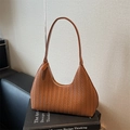 Caramel brown woven hobo shoulder bag with a sleek minimalist texture and zipper - Brown