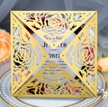Detail of laser-cut rose hollow wedding invitation with gold pearlescent paper finish - Gold