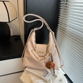 Versatile beige faux leather hobo bag with teddy charm and adjustable straps - With Charm / Off White