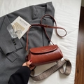 Brick red faux leather crossbody bag with gold logo and ethnic style woven strap - Brown No Pendant