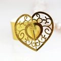 Elegant gold hollow heart napkin ring with ornate laser-cut pattern for wedding decor - Reflective Gold
