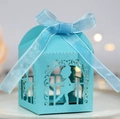 Macro shot of light blue laser-cut wedding candy box with a ballet dancer silhouette - Tiffany Blue
