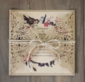 Macro view of laser cut kraft paper wedding invitation with hemp rope on wood surface - Kraft Paper