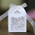 Elegant ivory laser-cut hollow wedding favor box with a delicate white organza ribbon bow - White