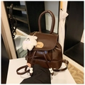 Detail view of vintage dark brown PU leather mini backpack with cute teddy bear charm - With Charm / Dark Coffee