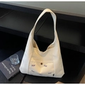 Dettaglio della borsa tote in tela bianco sporco con tasca esterna e ricamo TELN - Bianco Sporco