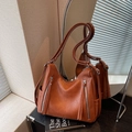 Vintage brown faux leather shoulder bag with vertical zippers and dual straps - Caramel color