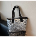 Macro detail of silver quilted tote bag showing metallic texture and rhombic stitching - Silver