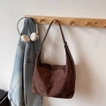 Brown suede hobo bag with crescent shape and leather strap hanging on a wooden hook - Coffee (No Pendant)