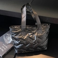 Chic black quilted puffer tote bag with glossy finish and spacious minimalist design - Black