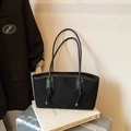 Elegant black quilted suede shoulder bag with gold hardware and drawstrings on books - No Pendant / Black