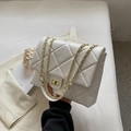 Elegant white quilted crossbody bag with gold chain strap and metallic twist lock - White