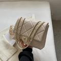 Elegant cream white quilted crossbody bag with gold chain strap and turn-lock closure - Beige