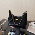 Black quilted crossbody bag with gold chain strap and frosted texture finish - Black