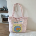Close-up of pink quilted tote bag featuring heart patterns and fish embroidery detail - Pink Fish