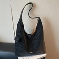 Large black hobo tote bag in matte leather finish with shoulder strap and charm - Black