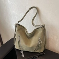 Olive green tote backpack with matte finish and star pendant zipper detail - Green