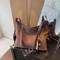 Brown faux suede shoulder tote bag with beaded charm and polished metal nameplate detail - Coffee with Pendant