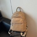 Light brown pebble leather backpack with multiple zip pockets and adjustable straps - Khaki
