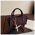 Macro detail of dark brown suede bag texture with vintage rivets and wood bead charms - Coffee with Pendant