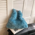 Light blue faux fur tote bag in a fluffy plush texture for casual autumn winter style - Blue