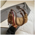 Detail of khaki suede crescent bag featuring brown leather knot and chocolate charm - Khaki With Pendant