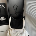 Faux suede underarm bag in black with white plush trim and leather shoulder strap - Black