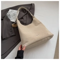 Detail of retro matte beige suede tote with a round mini pouch on grey blazer - Off White