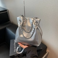 Silver metallic bucket bag with woven chain handle and adjustable crossbody strap - Silver