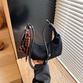 Black suede crescent bag featuring thick knotted strap and creative cookie pendants - Black with Pendant