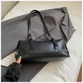 Minimalist black retro shoulder bag with silver buckles on a grey suit jacket - Black without Pendant