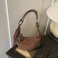Brown faux suede crescent bag featuring realistic chocolate and pretzel charm accents - Coffee with Pendant