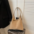 Retro khaki suede hobo tote bag with wide strap on silver suitcase backdrop - Khaki