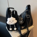 Black ruched hobo bag with adjustable strap and cloud plush charm detail - Black