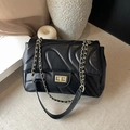 Elegant black quilted leather crossbody bag with gold-tone hardware and chain strap - Black