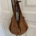 Minimalist large brown suede tote bag featuring a wide shoulder strap and soft texture - Brown
