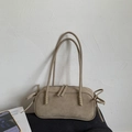 Detail of khaki suede shoulder bag with elegant bow drawstring accents and dual handles - Khaki