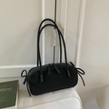 Minimalist black matte canvas shoulder bag with ribbon knot accents and long handles - Black