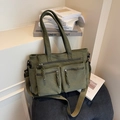 Green corduroy tote bag with dual zippered front pockets and a large capacity design - Green