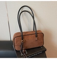 Detail shot of vintage dark brown suede handbag with elegant long black handles - With Charm / Brown