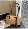 Close-up of suede shoulder bag with thin straps, branded logo, and decorative charm - With Charm / Khaki