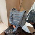 Light blue washed denim crossbody bag featuring multi-zipper pockets and HanCha embroidery - Light Blue
