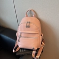 Pale pink lychee grain faux leather backpack with silver zippers and front pocket - Pink