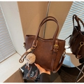 Retro dark brown leather bucket bag with plush charm and detachable shoulder strap - Coffee