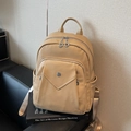 Fashionable light brown leather backpack with front zipper pocket and durable web straps - Khaki